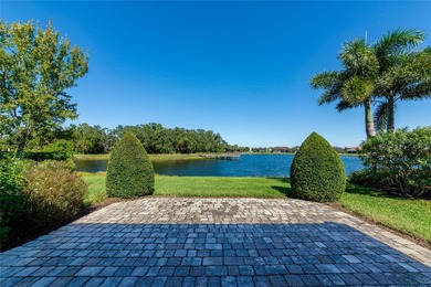 Experience stunning water views from this beautifully updated on Esplanade Golf and Country at Lakewood Ranch in Florida - for sale on GolfHomes.com, golf home, golf lot