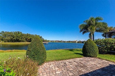 Experience stunning water views from this beautifully updated on Esplanade Golf and Country at Lakewood Ranch in Florida - for sale on GolfHomes.com, golf home, golf lot