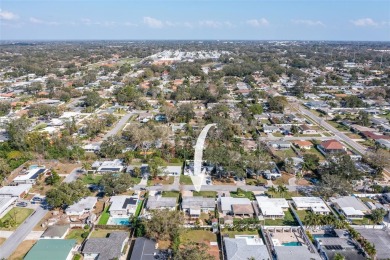 **NEW PRICE** High and Dry, 3-bedroom 2-bathroom concrete block on The Dunedin Country Club in Florida - for sale on GolfHomes.com, golf home, golf lot