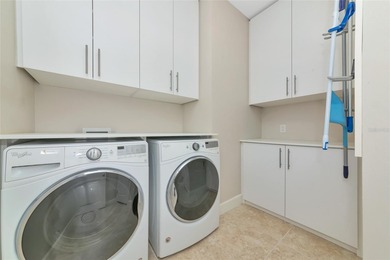 Experience stunning water views from this beautifully updated on Esplanade Golf and Country at Lakewood Ranch in Florida - for sale on GolfHomes.com, golf home, golf lot