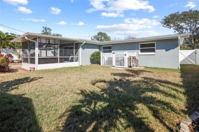 **NEW PRICE** High and Dry, 3-bedroom 2-bathroom concrete block on The Dunedin Country Club in Florida - for sale on GolfHomes.com, golf home, golf lot