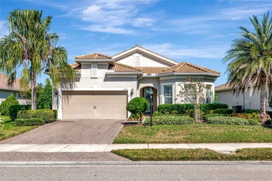 Experience stunning water views from this beautifully updated on Esplanade Golf and Country at Lakewood Ranch in Florida - for sale on GolfHomes.com, golf home, golf lot