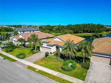 Experience stunning water views from this beautifully updated on Esplanade Golf and Country at Lakewood Ranch in Florida - for sale on GolfHomes.com, golf home, golf lot