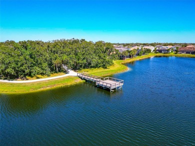 Experience stunning water views from this beautifully updated on Esplanade Golf and Country at Lakewood Ranch in Florida - for sale on GolfHomes.com, golf home, golf lot