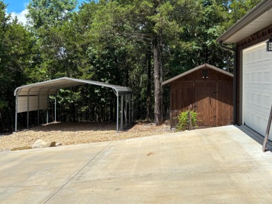 This 3 bedroom, 3 bath home sits on 6 lots in Country Club Hills on Lost Woods Golf Course in Missouri - for sale on GolfHomes.com, golf home, golf lot