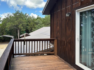 This 3 bedroom, 3 bath home sits on 6 lots in Country Club Hills on Lost Woods Golf Course in Missouri - for sale on GolfHomes.com, golf home, golf lot