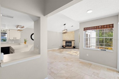 Welcome to 1675 Polo Club Dr, a home that makes it easy to slow on Tarpon Springs Golf Course in Florida - for sale on GolfHomes.com, golf home, golf lot