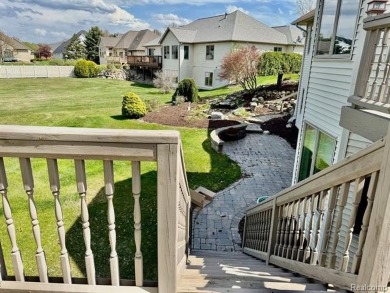 Greetings from this beautiful home at Woodridge Farms, adjacent on Copper Ridge Golf Club in Michigan - for sale on GolfHomes.com, golf home, golf lot