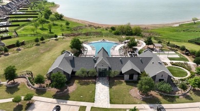 Discover the epitome of lakeside living in this stunning Perry on The Tribute At the Colony in Texas - for sale on GolfHomes.com, golf home, golf lot