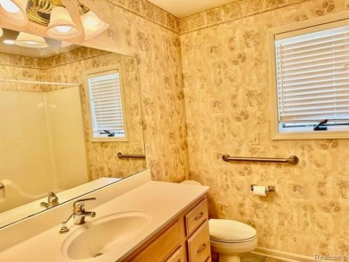 Greetings from this beautiful home at Woodridge Farms, adjacent on Copper Ridge Golf Club in Michigan - for sale on GolfHomes.com, golf home, golf lot