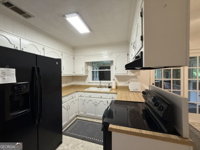 Check out this amazing brick home located near Forest Heights on Forest Heights Country Club in Georgia - for sale on GolfHomes.com, golf home, golf lot