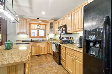 Pride of ownership is evident in this meticulously maintained on Northern Bay Golf Resort and Marina in Wisconsin - for sale on GolfHomes.com, golf home, golf lot