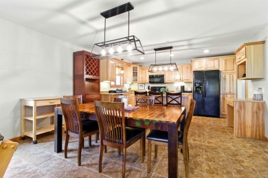 Pride of ownership is evident in this meticulously maintained on Northern Bay Golf Resort and Marina in Wisconsin - for sale on GolfHomes.com, golf home, golf lot