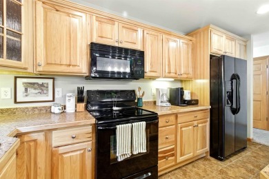 Pride of ownership is evident in this meticulously maintained on Northern Bay Golf Resort and Marina in Wisconsin - for sale on GolfHomes.com, golf home, golf lot