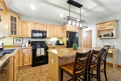 Pride of ownership is evident in this meticulously maintained on Northern Bay Golf Resort and Marina in Wisconsin - for sale on GolfHomes.com, golf home, golf lot