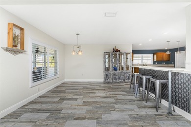 Impressive and spacious  4 Bedroom, 3 Bathroom home with on Kingsway Country Club in Florida - for sale on GolfHomes.com, golf home, golf lot