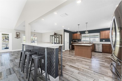 Impressive and spacious  4 Bedroom, 3 Bathroom home with on Kingsway Country Club in Florida - for sale on GolfHomes.com, golf home, golf lot