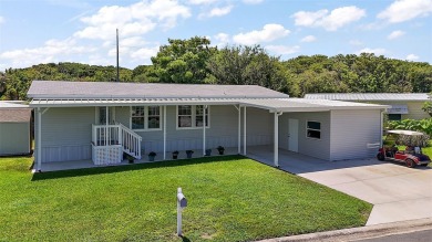 Come see this WATERFRONT 2 BED / 2 BATH / BONUS ROOM on Bay Tree Golf Course in Florida - for sale on GolfHomes.com, golf home, golf lot