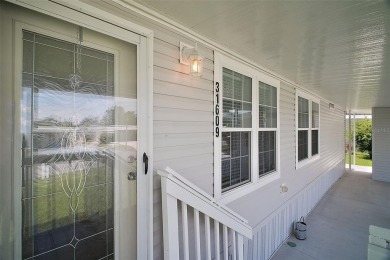 Come see this WATERFRONT 2 BED / 2 BATH / BONUS ROOM on Bay Tree Golf Course in Florida - for sale on GolfHomes.com, golf home, golf lot