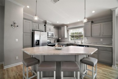 Come see this WATERFRONT 2 BED / 2 BATH / BONUS ROOM on Bay Tree Golf Course in Florida - for sale on GolfHomes.com, golf home, golf lot