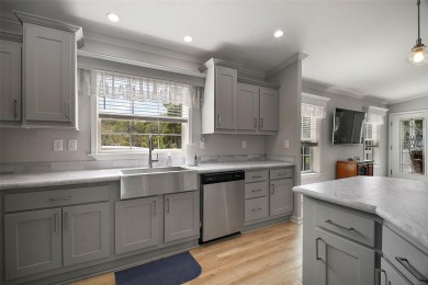 Come see this WATERFRONT 2 BED / 2 BATH / BONUS ROOM on Bay Tree Golf Course in Florida - for sale on GolfHomes.com, golf home, golf lot