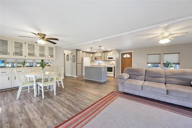 Enjoy relaxed Florida living in this 1978 home nestled inside a on Maple Leaf Golf and Country Club in Florida - for sale on GolfHomes.com, golf home, golf lot