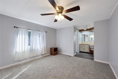 Enjoy relaxed Florida living in this 1978 home nestled inside a on Maple Leaf Golf and Country Club in Florida - for sale on GolfHomes.com, golf home, golf lot