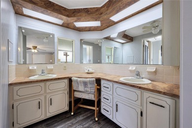 Enjoy relaxed Florida living in this 1978 home nestled inside a on Maple Leaf Golf and Country Club in Florida - for sale on GolfHomes.com, golf home, golf lot