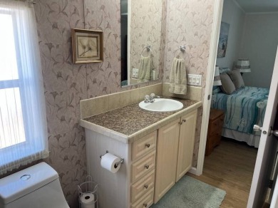 IF YOU ARE LOOKING FOR A 2 BEDROOMN 2 BATH IN MOVE-IN CONDITION on Southport Springs Golf Club in Florida - for sale on GolfHomes.com, golf home, golf lot