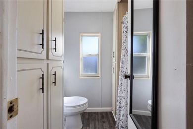 Enjoy relaxed Florida living in this 1978 home nestled inside a on Maple Leaf Golf and Country Club in Florida - for sale on GolfHomes.com, golf home, golf lot