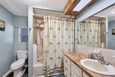 Enjoy relaxed Florida living in this 1978 home nestled inside a on Maple Leaf Golf and Country Club in Florida - for sale on GolfHomes.com, golf home, golf lot