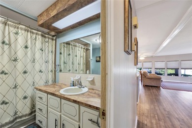 Enjoy relaxed Florida living in this 1978 home nestled inside a on Maple Leaf Golf and Country Club in Florida - for sale on GolfHomes.com, golf home, golf lot