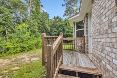 This 3 bed, 2 bath home built in 2023 is just a baby which means on Diamondhead Country Club in Mississippi - for sale on GolfHomes.com, golf home, golf lot