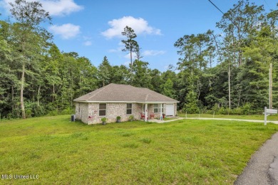 This 3 bed, 2 bath home built in 2023 is just a baby which means on Diamondhead Country Club in Mississippi - for sale on GolfHomes.com, golf home, golf lot