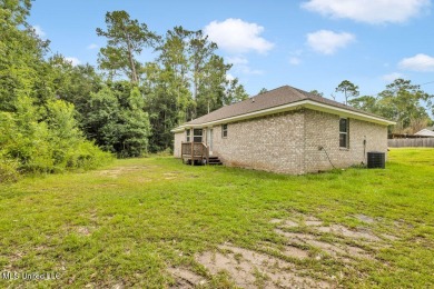 This 3 bed, 2 bath home built in 2023 is just a baby which means on Diamondhead Country Club in Mississippi - for sale on GolfHomes.com, golf home, golf lot