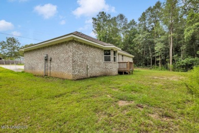 This 3 bed, 2 bath home built in 2023 is just a baby which means on Diamondhead Country Club in Mississippi - for sale on GolfHomes.com, golf home, golf lot