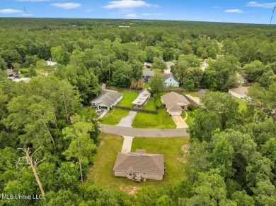 This 3 bed, 2 bath home built in 2023 is just a baby which means on Diamondhead Country Club in Mississippi - for sale on GolfHomes.com, golf home, golf lot