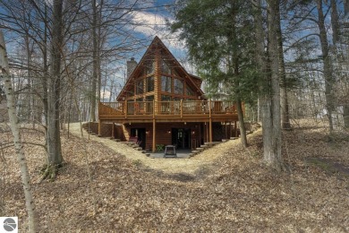 Superb log home character in a gated community on the signature on Shanty Creek Golf Course in Michigan - for sale on GolfHomes.com, golf home, golf lot