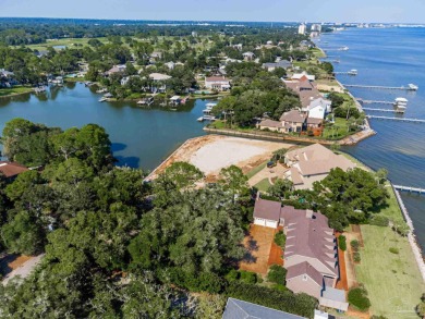 Waterfront Living at Star Lake Discover a rare opportunity to on Pensacola Country Club in Florida - for sale on GolfHomes.com, golf home, golf lot
