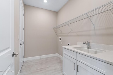 BEAUTIFUL highly-upgraded home in Windchase neighborhood of on Halifax Plantation Golf Club in Florida - for sale on GolfHomes.com, golf home, golf lot