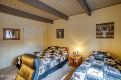 Surrounded by tall pines, this fully-furnished lower-level condo on Pinetop Lakes Golf and Country Club in Arizona - for sale on GolfHomes.com, golf home, golf lot