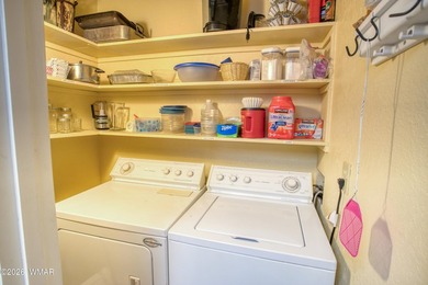 Surrounded by tall pines, this fully-furnished lower-level condo on Pinetop Lakes Golf and Country Club in Arizona - for sale on GolfHomes.com, golf home, golf lot