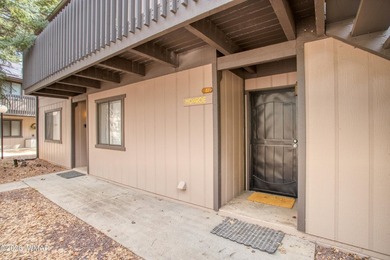 Surrounded by tall pines, this fully-furnished lower-level condo on Pinetop Lakes Golf and Country Club in Arizona - for sale on GolfHomes.com, golf home, golf lot