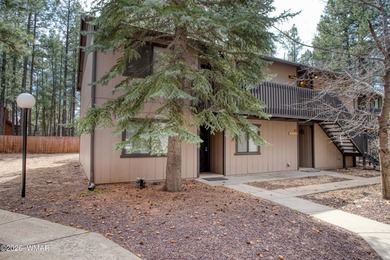 Surrounded by tall pines, this fully-furnished lower-level condo on Pinetop Lakes Golf and Country Club in Arizona - for sale on GolfHomes.com, golf home, golf lot