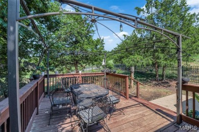 Welcome to your dream home in the exclusive, gated Raintree on Raintree Country Club in Missouri - for sale on GolfHomes.com, golf home, golf lot