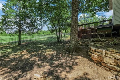 Welcome to your dream home in the exclusive, gated Raintree on Raintree Country Club in Missouri - for sale on GolfHomes.com, golf home, golf lot