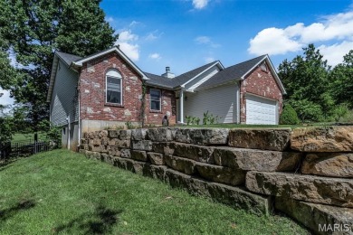 Welcome to your dream home in the exclusive, gated Raintree on Raintree Country Club in Missouri - for sale on GolfHomes.com, golf home, golf lot
