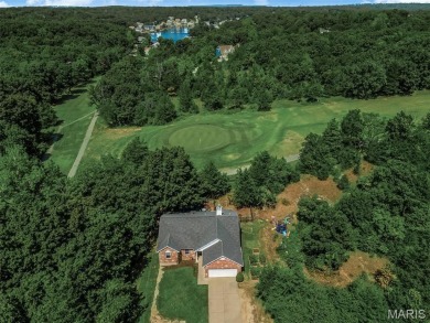 Welcome to your dream home in the exclusive, gated Raintree on Raintree Country Club in Missouri - for sale on GolfHomes.com, golf home, golf lot