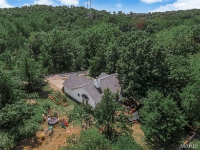 Welcome to your dream home in the exclusive, gated Raintree on Raintree Country Club in Missouri - for sale on GolfHomes.com, golf home, golf lot