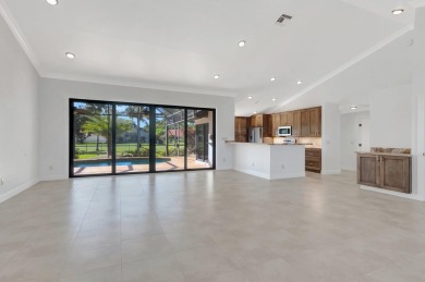 Nestled in the heart of Boca Woods Country Club, this home sits on Boca Woods Country Club in Florida - for sale on GolfHomes.com, golf home, golf lot